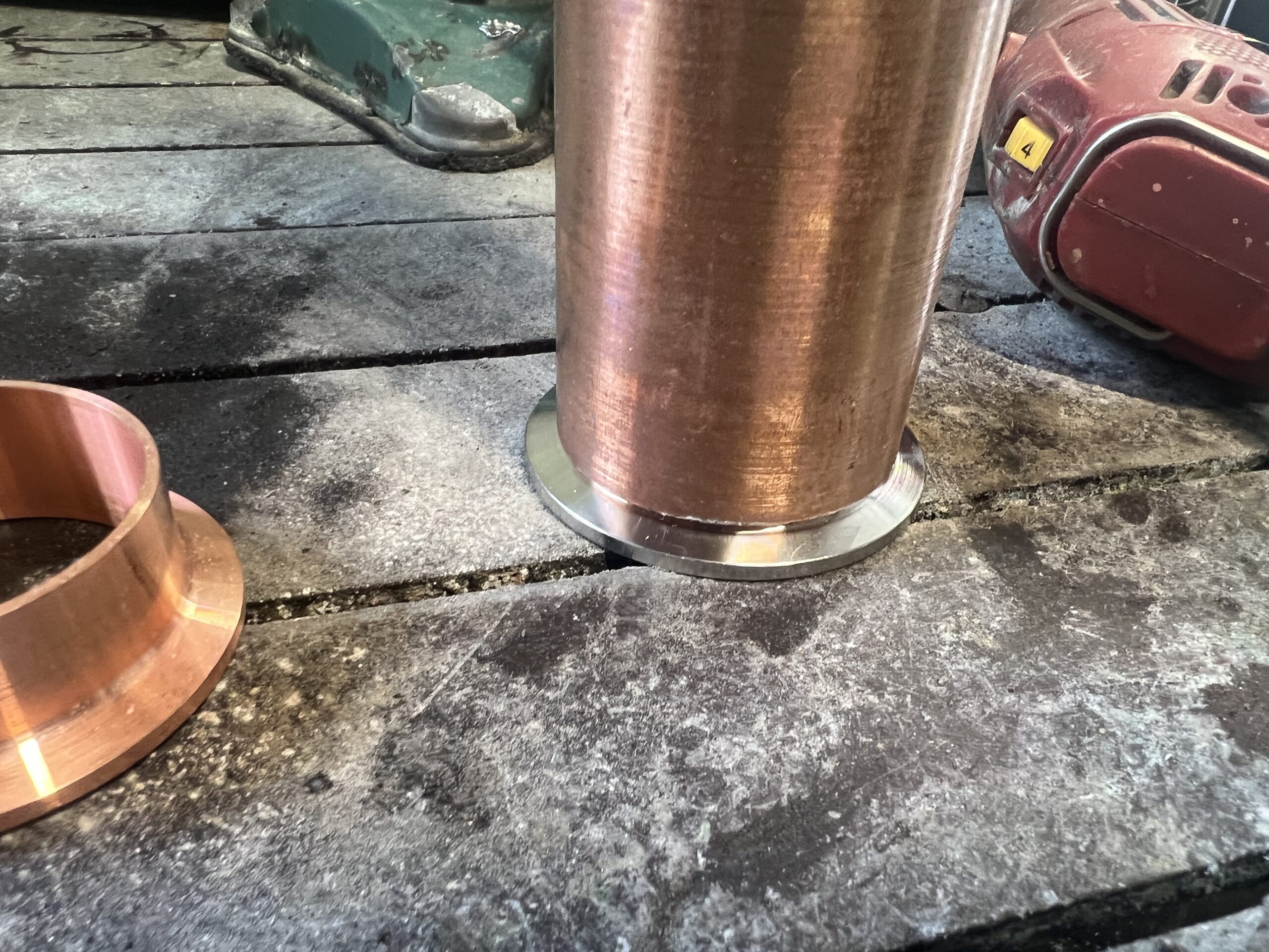 Stainless ferrule inside 2-inch copper pipe.