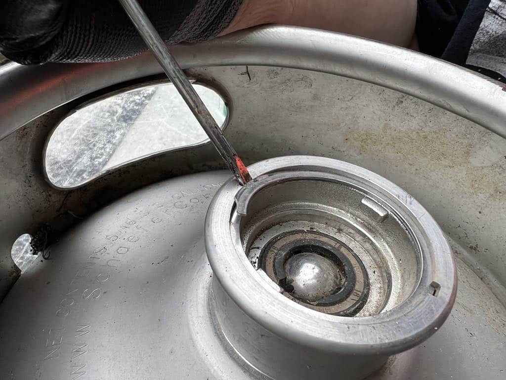 Starting to remove a spear from a keg.