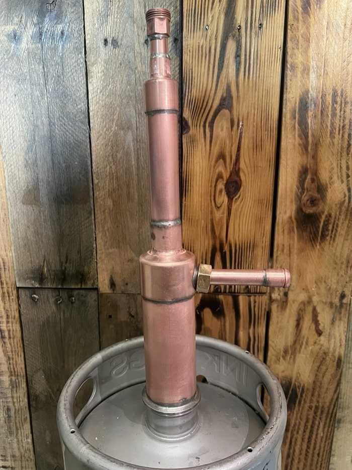 Downcomer for turning kegs into distilling thumper