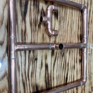 Copper support stand for keg stills.