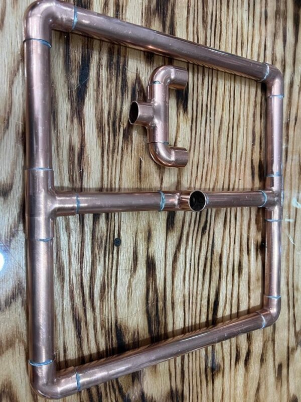 Copper support stand for keg stills.