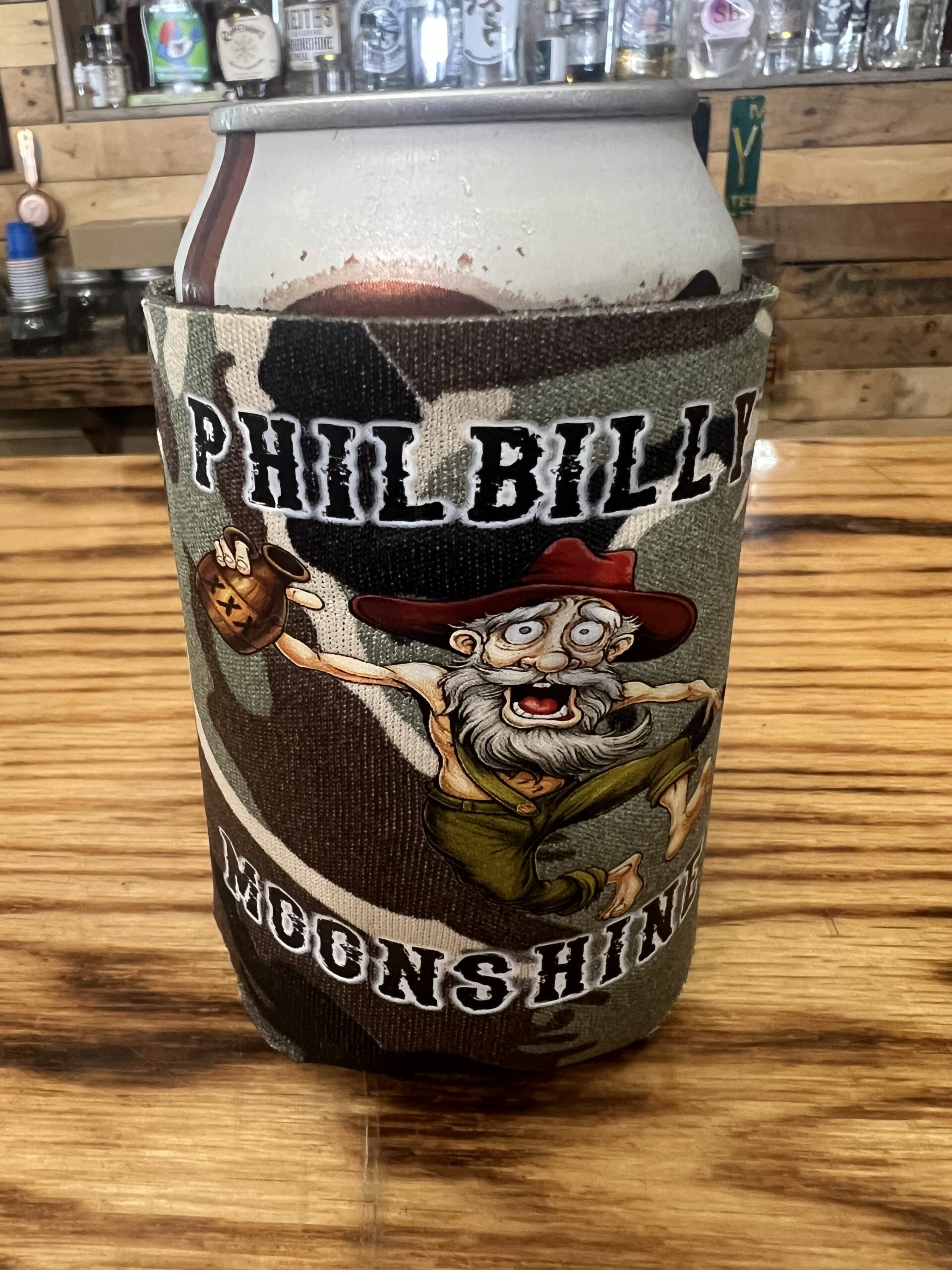PhilBilly Moonshine insulated can koozie with official company logo on a standard 12oz beverage can.