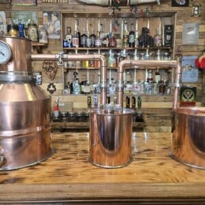5 gallon handcrafted copper moonshine still with matching thumper and worm condenser coil.